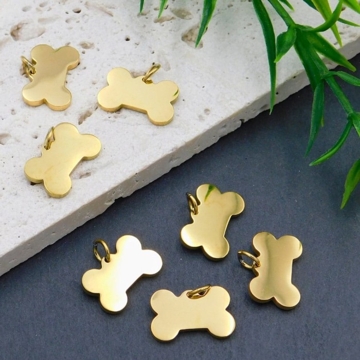 Zawieszka kość dla psa stal nierdzewna 15x10mm złota (1szt.)