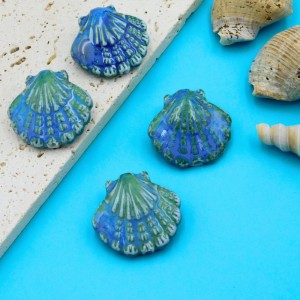 Koralik ceramiczny muszla 29x27x11mm niebiesko-zielony (1szt.)