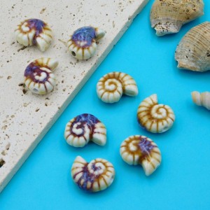 Koralik ceramiczny muszla 22x16x10mm biało-beżowy (1szt.)