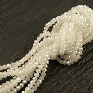Oponki fasetowane szklane 3.5x2.5mm mleczne z połyskiem (około 140szt.)