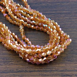 Kryształki szklane bicone 4mm pomarańczowe opalizujące (około 75szt.)