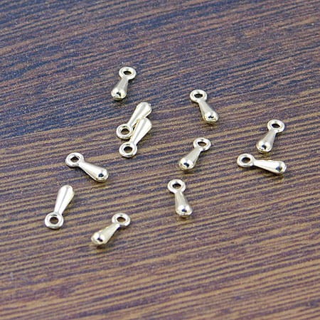 Zawieszka, końcówka łańcuszka sopelek z metalu 7x2mm jasna złota (50szt)