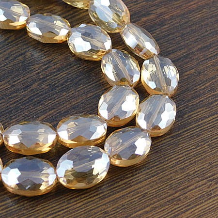 Owal fasetowany ze szkła 16x12x7mm złoty (4szt.)