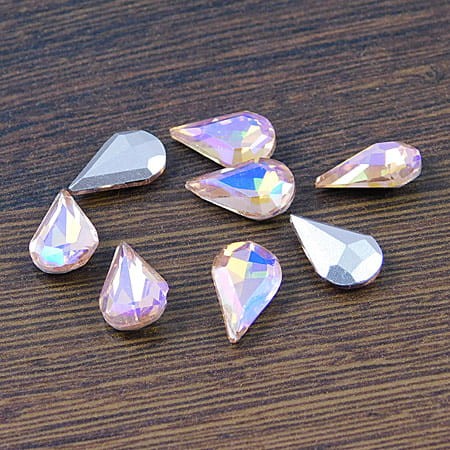 Kaboszon łezka fasetowana ze szkła 13x8x4mm brzoskwiniowo-różowa (1szt)