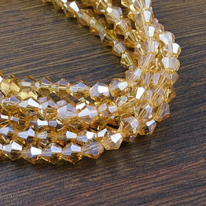 Koraliki szklane kryształki bicone 6mm jasny bursztynowy AB (45szt.)