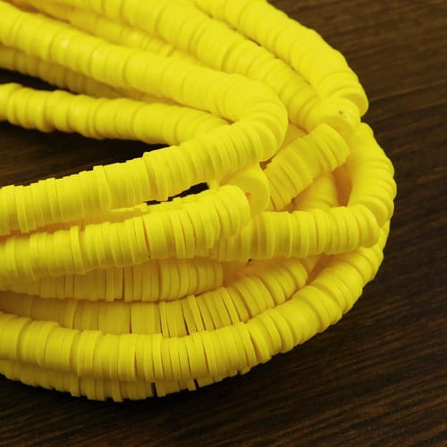 Koraliki Heishi 6x1mm żółte (sznur 45cm)