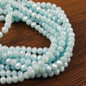 Oponki fasetowane ze szkła 6x4.5mm jasne niebieskie z perłowym połsykiem (20szt.)