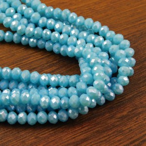 Oponki fasetowane ze szkła 6x4.5mm niebieskie z perłowym połsykiem (20szt.)