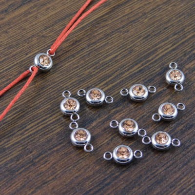 Łącznik ze stali nierdzewnej z cyrkonią  brudny róż 12x6.5mm (1szt)