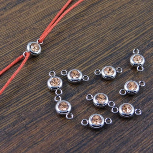 Łącznik ze stali nierdzewnej z cyrkonią  brudny róż 12x6.5mm (1szt)