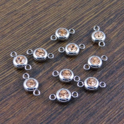Łącznik ze stali nierdzewnej z cyrkonią  brudny róż 12x6.5mm (1szt)