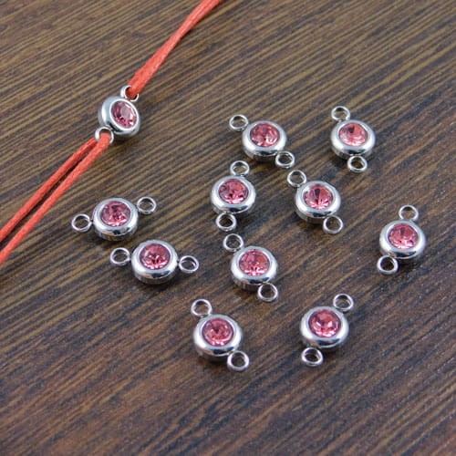 Łącznik ze stali nierdzewnej z cyrkonią różową 12x6.5mm (1szt)