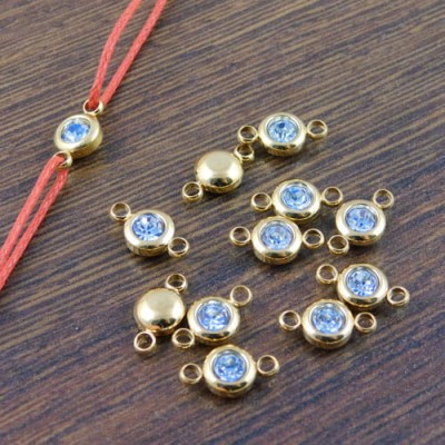 zloty-lacznik-bizuteryjny-z-niebieska-cyrkonia-12mm-stal