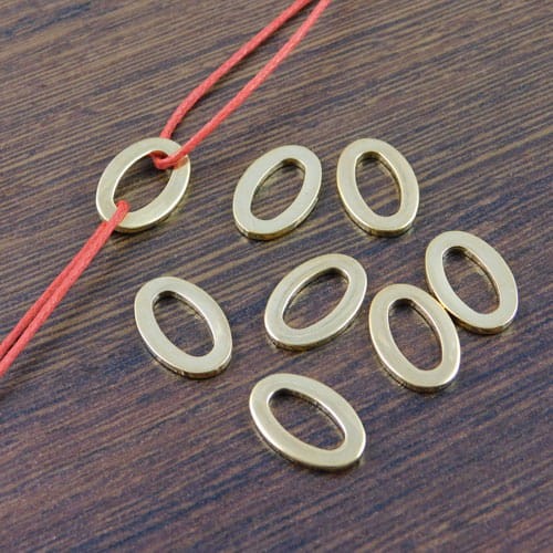 Łącznik owal stal nierdzewna 15x10mm złoty (1szt)