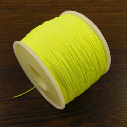 Sznurek z poliestru 0.6mm żółty neonowy (szpulka około 120m)