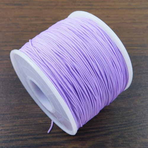 Sznurek z poliestru 0.6mm jasny fiolet (szpulka około 120m)