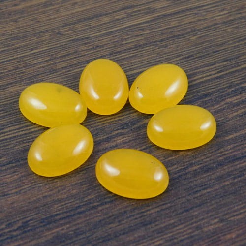 Kaboszon jadeit żółty owal 18-19x13x5.5mm (1szt)
