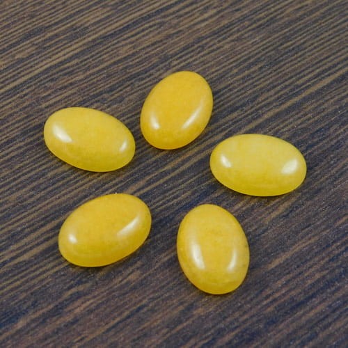 Kaboszon jadeit żółty owal 14x10x4.5mm (1szt.)