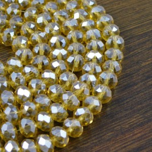 Oponki fasetowane ze szkła 8x6mm jasno bursztynowe z połyskiem (20szt)