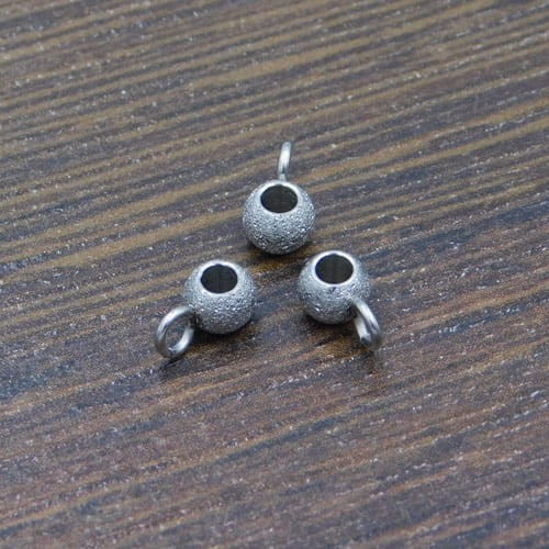 Podwieszka chropowata stal nierdzewna 7x4mm ciemna srebrna (1szt)