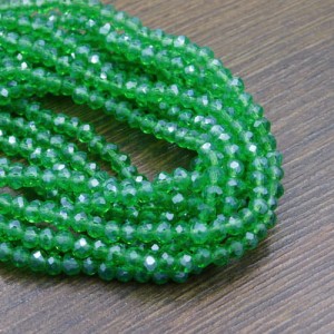 Oponki fasetowane ze szkła 4x3.5mm zielone z perłowym połyskiem (110szt.)