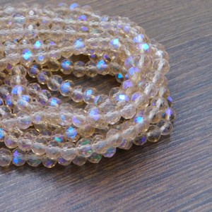 Oponki fasetowane ze szkła 6x4.5mm brzoskwiniowe z tęczowym połyskiem (20szt.)