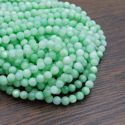 Masa perłowa barwiona kulki 4mm jasne zielone (sznur 95szt.)