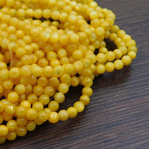 Masa perłowa barwiona kulki 4mm żółte (sznur 95szt.)