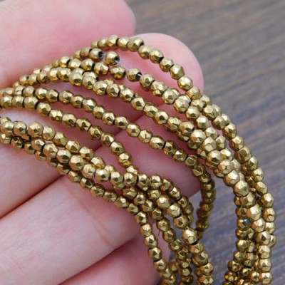 Hematyt kulki fasetowane 2-2.5mm złote (200szt.)